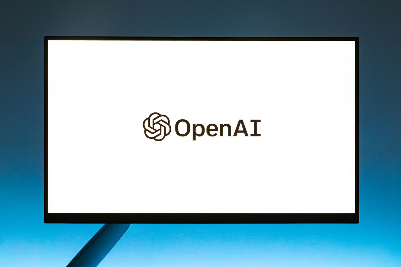 about-01 Minimalistic display of OpenAI logo on a monitor with a gradient blue background, representing modern technology.